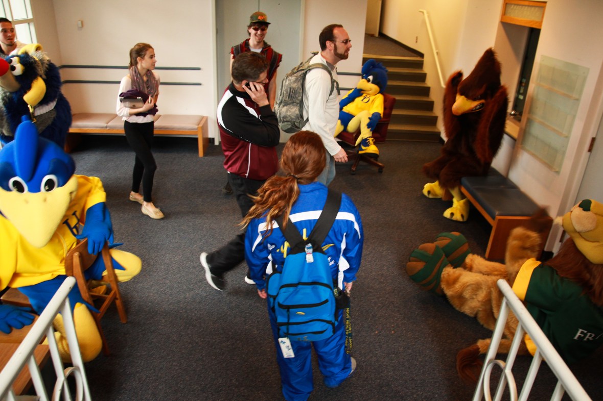 Mascots gather in a hallway at Dave Raymond's Mascot Boot Camp, University of Delaware